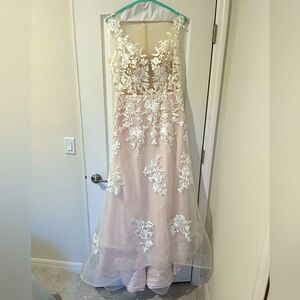 Sleeveless pink/ivory wedding dress with floral appliqués and a removable skirt